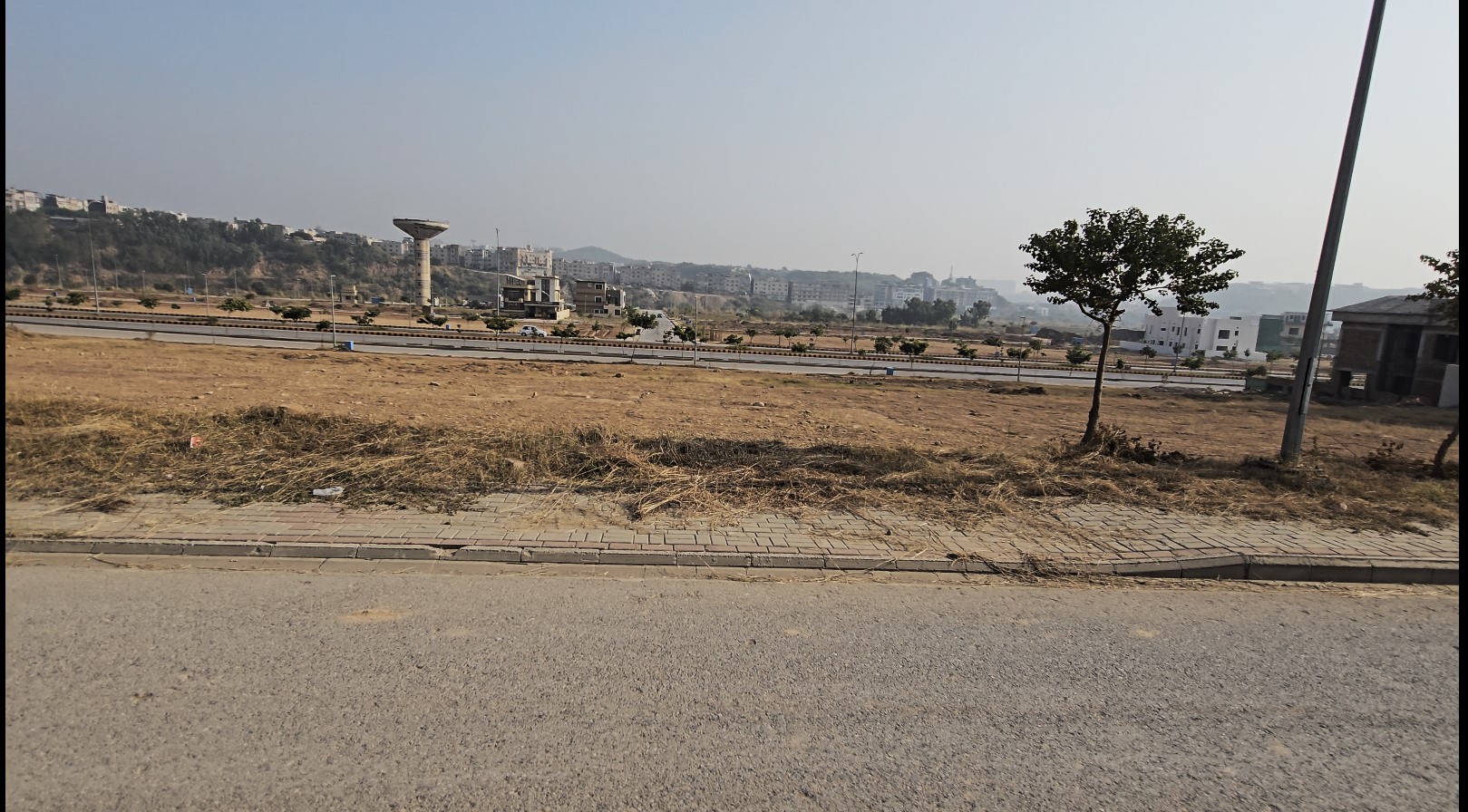 1 dha phase 4 sec A st 1 plot 23 Alt Text: Peaceful residential neighbourhood in DHA Phase 4