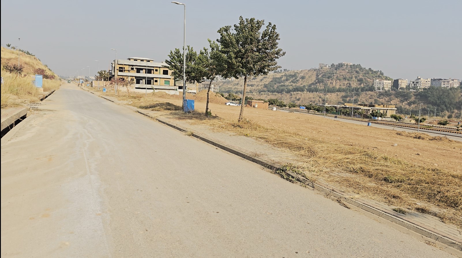 2dha phase 4 sec A st 1 plot 23 Alt Text: Peaceful residential neighbourhood in DHA Phase 4