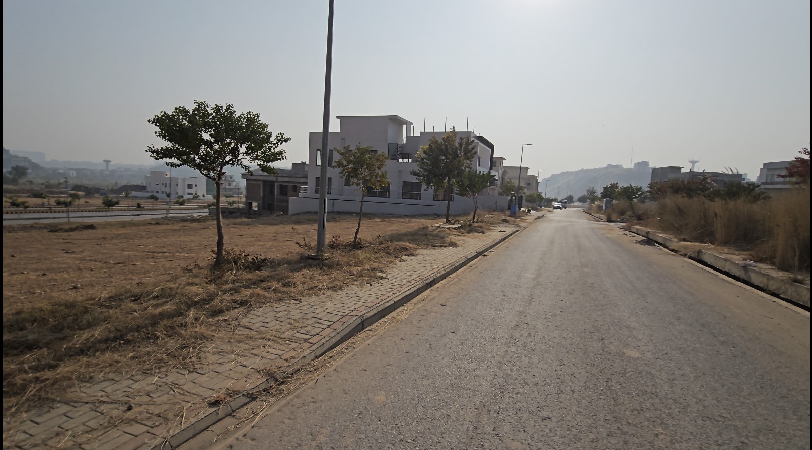 dha phase 4 sec A st 1 plot 23 Alt Text: Peaceful residential neighbourhood in DHA Phase 4